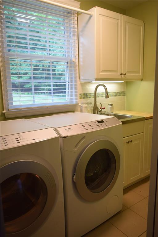 406 Buckingham Road Fox Chapel, PA 15215 - Photo 18 of 25 The efficient laundry room is conveniently located on the upper level at the top of the stairs between the two upper level bathrooms. The extra large capacity Miele washer and dryer make quick work of whatever laundry challenges your family can come up with, and it's just a few short steps to the bedrooms so the clean loads of folded laundry can efficiently be put away.