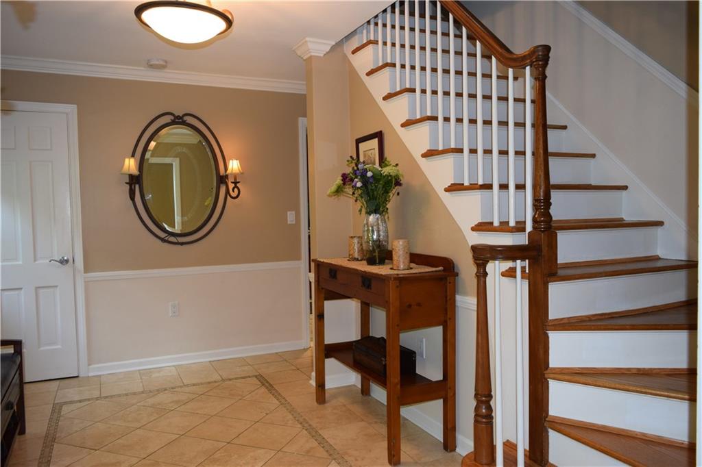 406 Buckingham Road Fox Chapel, PA 15215 - Photo 3 of 25 A bright entry accented by travertine tile and crisp white trim welcomes guests.