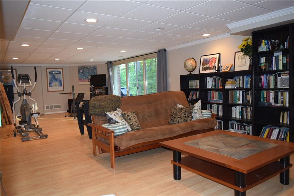 406 Buckingham Road Fox Chapel, PA 15215 - Photo 21 of 25 There's a huge game room on the lower level -- plenty of space for reading, watching movies, playing games, working out, and other fun family activities.