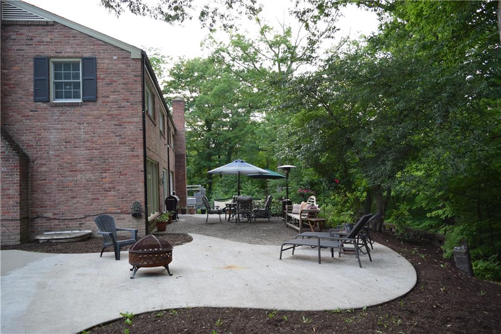 406 Buckingham Road Fox Chapel, PA 15215 - Photo 23 of 25 This expansive patio is perfect for grilling, al fresco dining and outdoor entertaining. The lush wooded yard provides a leafy backdrop as well as privacy.