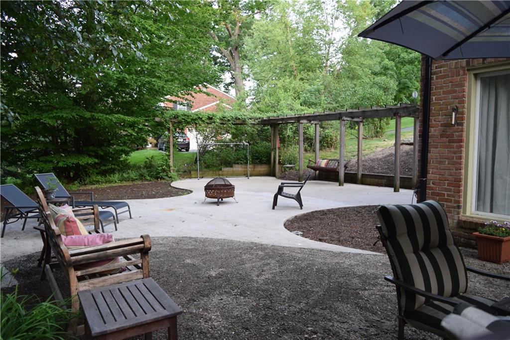 406 Buckingham Road Fox Chapel, PA 15215 - Photo 24 of 25 A wisteria-crowned pergola provides a comfortable enclosure for the classic porch swing and is a perfect vantage point for the multi-tiered yard.
