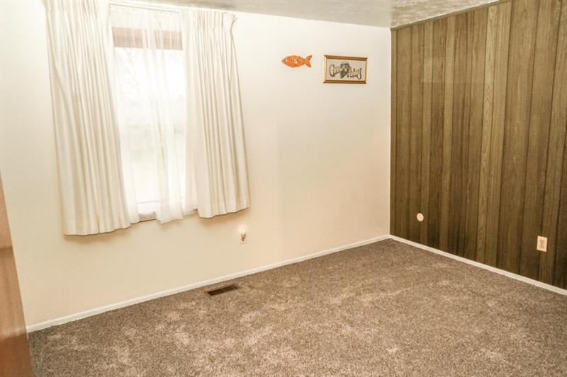 223 East Union Road Cheswick, PA 15024 - Photo 15 of 25 Second Bedroom is approx. 11x10 in Size and was the original Master Bedroom before the addition. Wood Paneled Accent Wall could be white-washed for an updated rustic look. Large Window allows morning sun throughout the room.