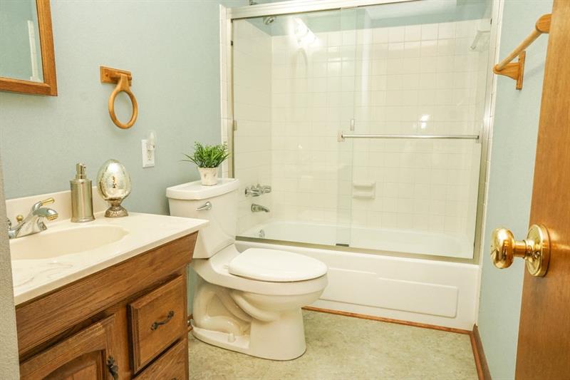 223 East Union Road Cheswick, PA 15024 - Photo 16 of 25 Secondary Bathroom feels so crisp and clean! Newer Vinyl flooring, updated tub/shower combo surround and glass doors. So pretty and spa-like!