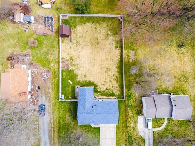 223 East Union Road Cheswick, PA 15024 - Photo 23 of 25 Situated on approximately .37 acres this home has one of the best yards in the neighborhood. Almost table-top flat and fenced in with a compost garden, shed w/ loft for additional storage and small garden area. The grass seed planted in the back yard will turn green around May each year. See next photo for just how beautiful it grows!