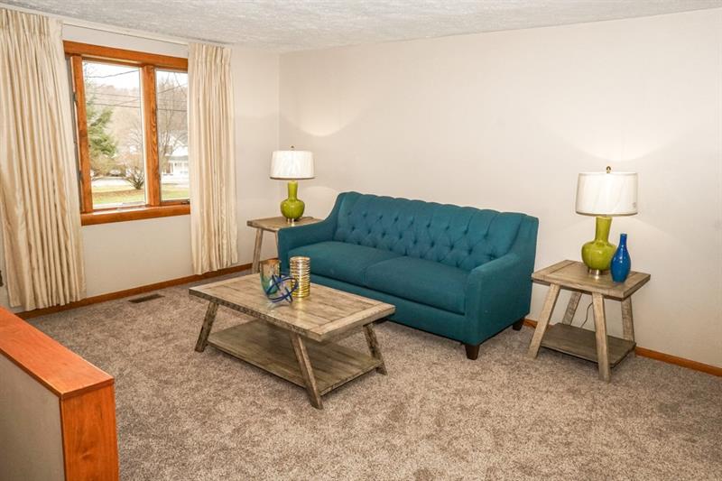 223 East Union Road Cheswick, PA 15024 - Photo 4 of 25 Bay Window allows light to flow into the approx. 15x11 Living Room. Neutral walls, wood trim and new carpeting throughout home are highlights to this space. Clean walls are awaiting your decor to dress up the room.