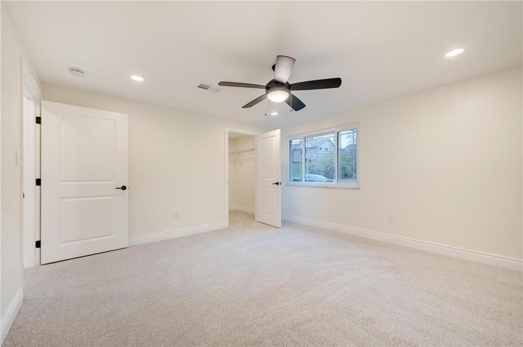 18 Seneca Road Pittsburgh, PA 15241 - Photo 15 of 25 an empty room with ceiling fan and windows