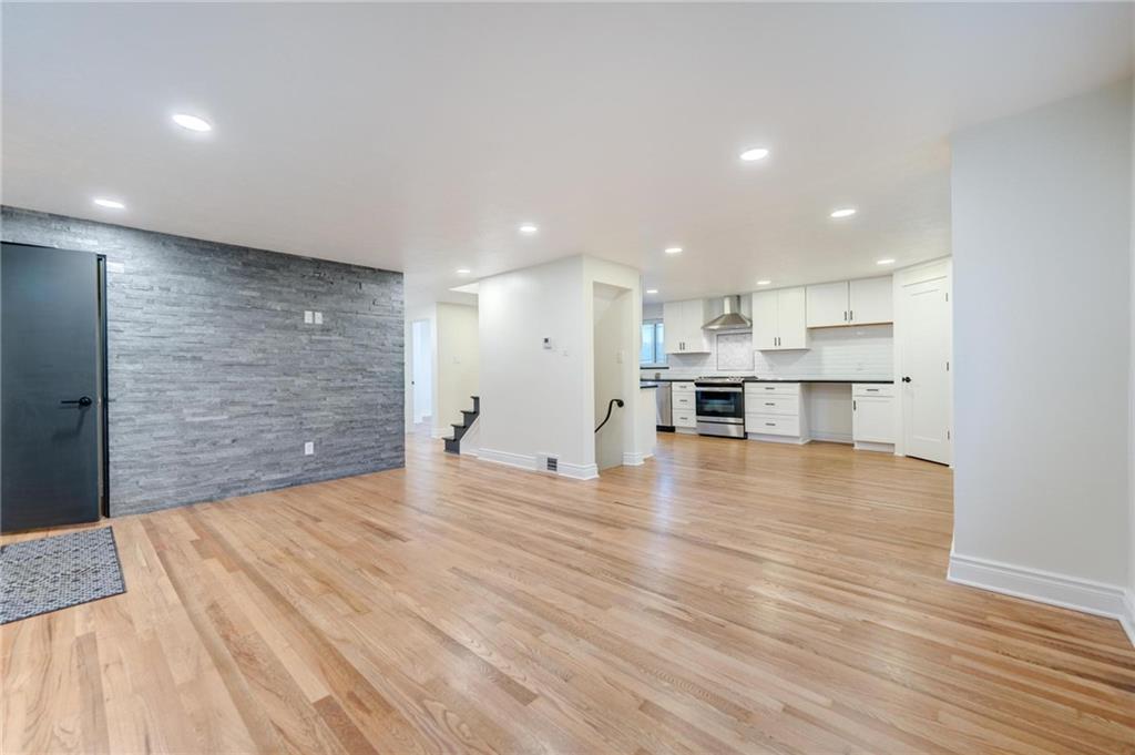 18 Seneca Road Pittsburgh, PA 15241 - Photo 6 of 25 an empty room with wooden floor and windows