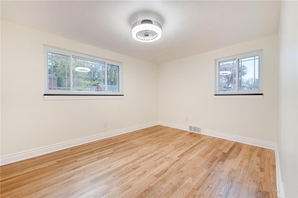 18 Seneca Road Pittsburgh, PA 15241 - Photo 10 of 25 a view of empty room with wooden floor