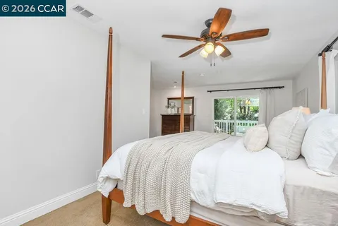a bathroom with a toilet and a shower curtain
