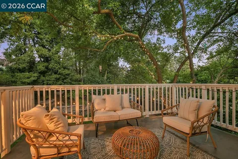 a view of outdoor dining space with a patio and a garden