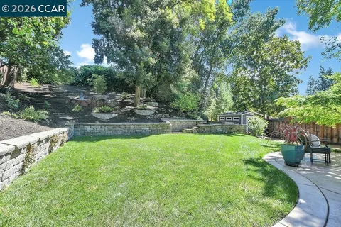 a view of a patio with a table and chairs in patio