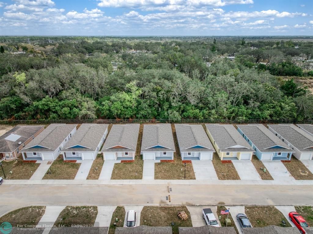 Undisclosed Address Sebring, FL 33870 - Photo 1 of 11 an aerial view of a house with a yard