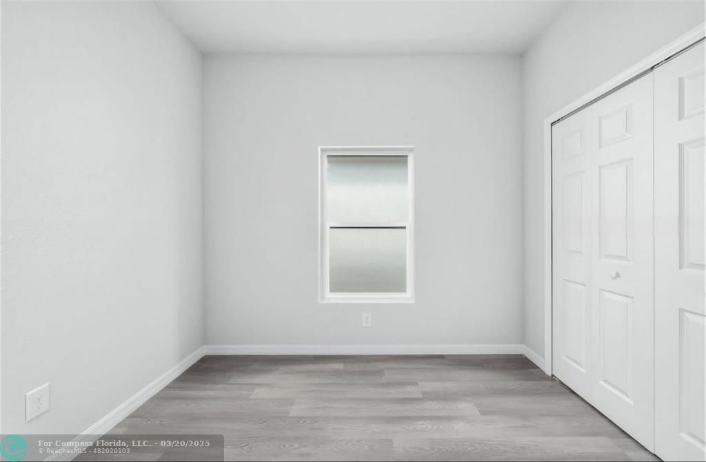 Undisclosed Address Sebring, FL 33870 - Photo 7 of 11 an empty room with wooden floor and windows