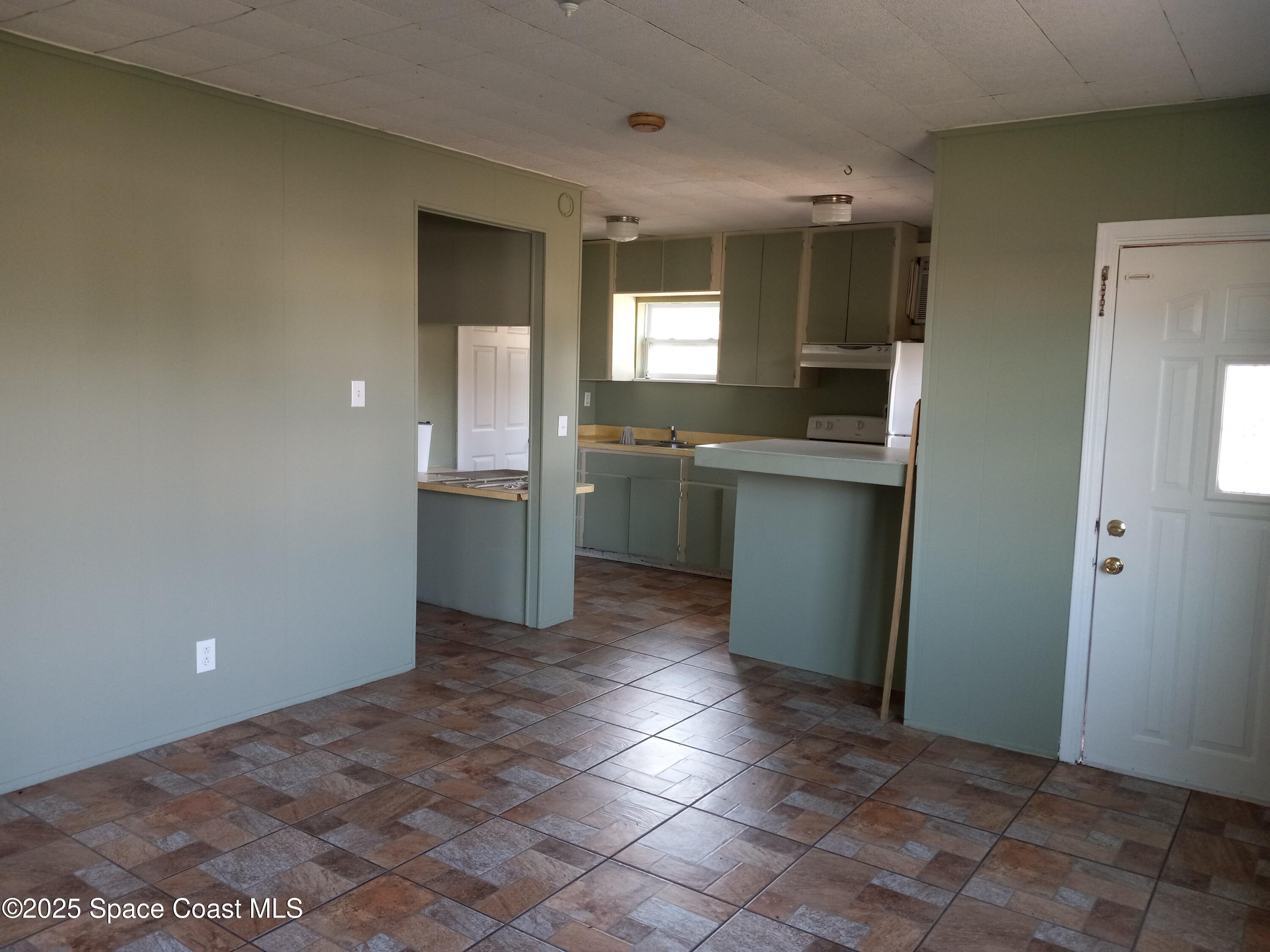 205 Lucas Road Merritt Island, FL 32953 - Photo 5 of 12 Living Room / Kitchen