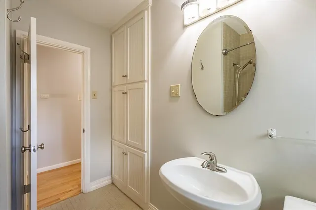 a bathroom with a sink and a mirror