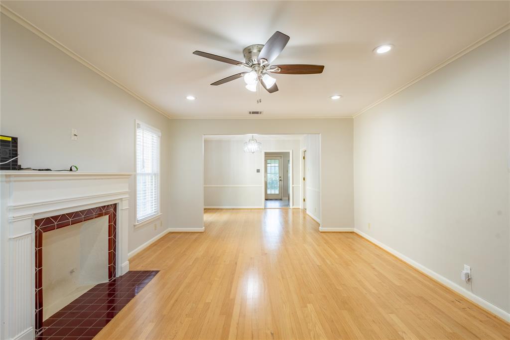 6165 Ravendale Lane Dallas, TX 75214 - Photo 5 of 40 a view of empty room with wooden floor and fan