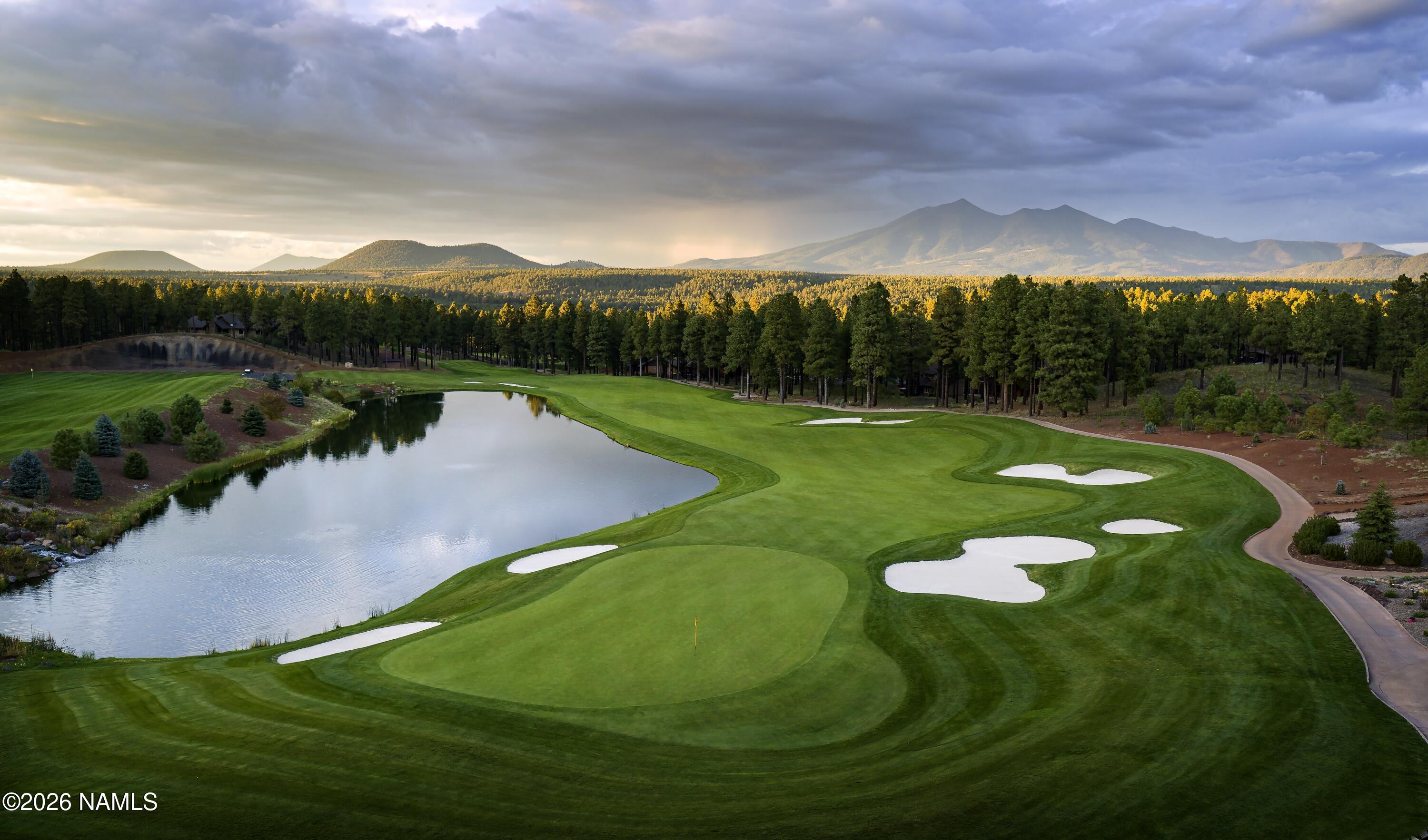 4655 Snaffle Bit Flagstaff, AZ 86005 - Photo 25 of 26 a view of a golf course with a garden