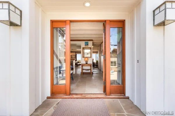 hallway view with living room and dining room view
