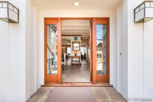 hallway view with living room and dining room view