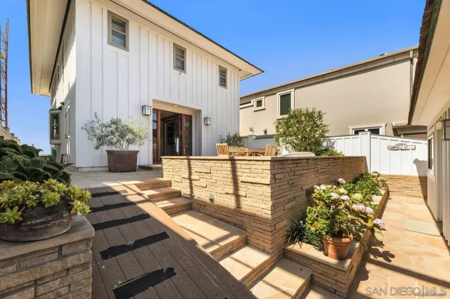 a view of a balcony with wooden floor