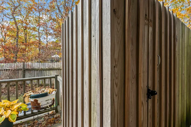 a view of a balcony with wooden floor