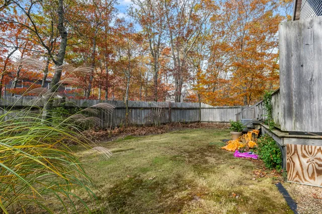 a backyard of a house with lots of green space