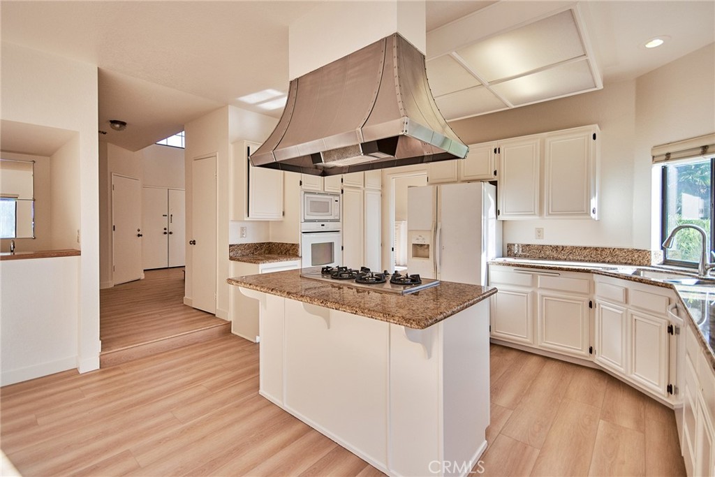 24352 East Rimford Place Diamond Bar, CA 91765 - Photo 11 of 31 a kitchen with stainless steel appliances granite countertop a stove and a sink