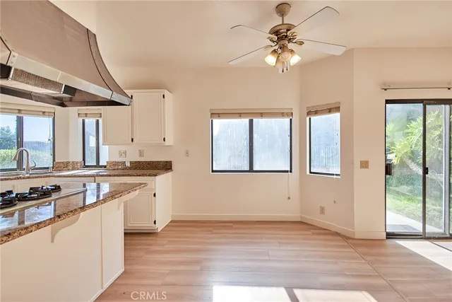 a view of a kitchen with a sink and a window