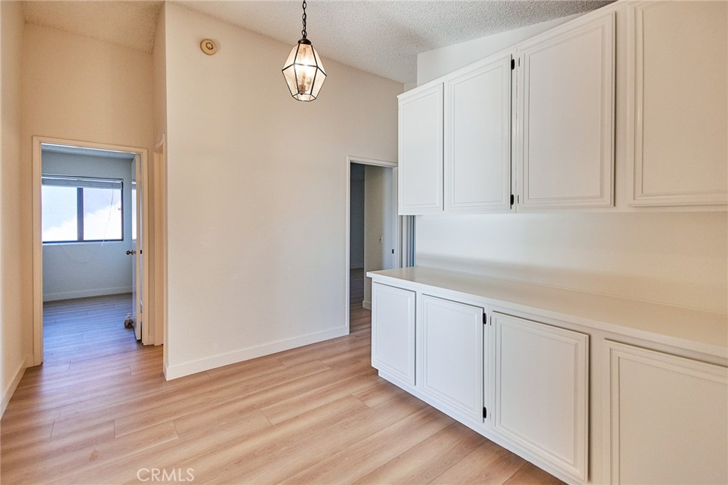 24352 East Rimford Place Diamond Bar, CA 91765 - Photo 15 of 31 a view of a kitchen with wooden floor and electronic appliances
