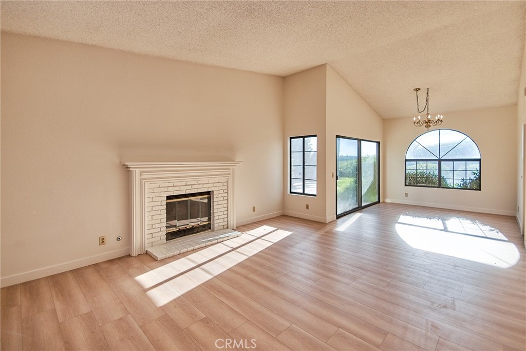 24352 East Rimford Place Diamond Bar, CA 91765 - Photo 2 of 31 a view of an empty room with a fireplace and a window