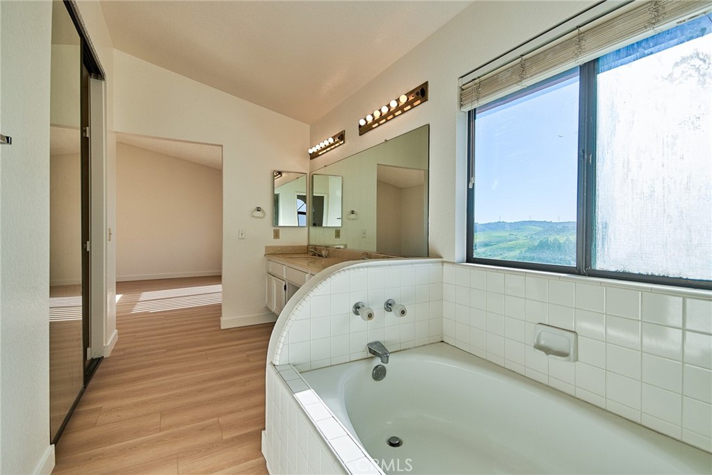 24352 East Rimford Place Diamond Bar, CA 91765 - Photo 21 of 31 a bathroom with a tub and a window