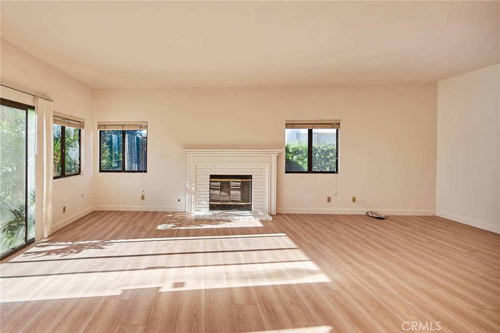 24352 East Rimford Place Diamond Bar, CA 91765 - Photo 4 of 31 a view of an empty room with wooden floor and a window