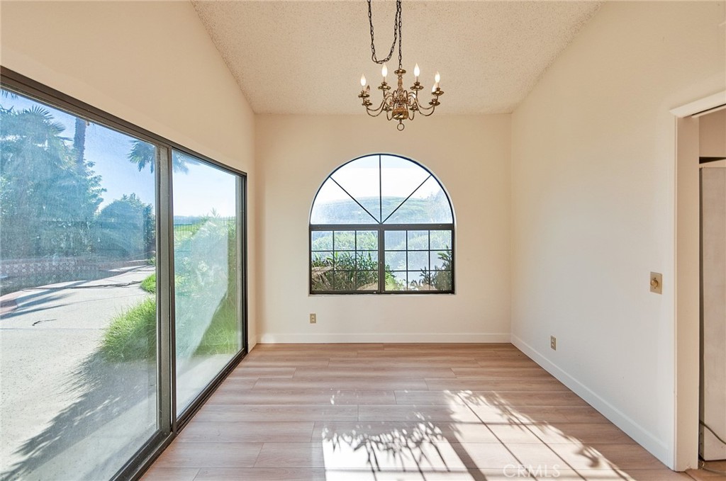 24352 East Rimford Place Diamond Bar, CA 91765 - Photo 7 of 31 a view of empty room with wooden floor and fan