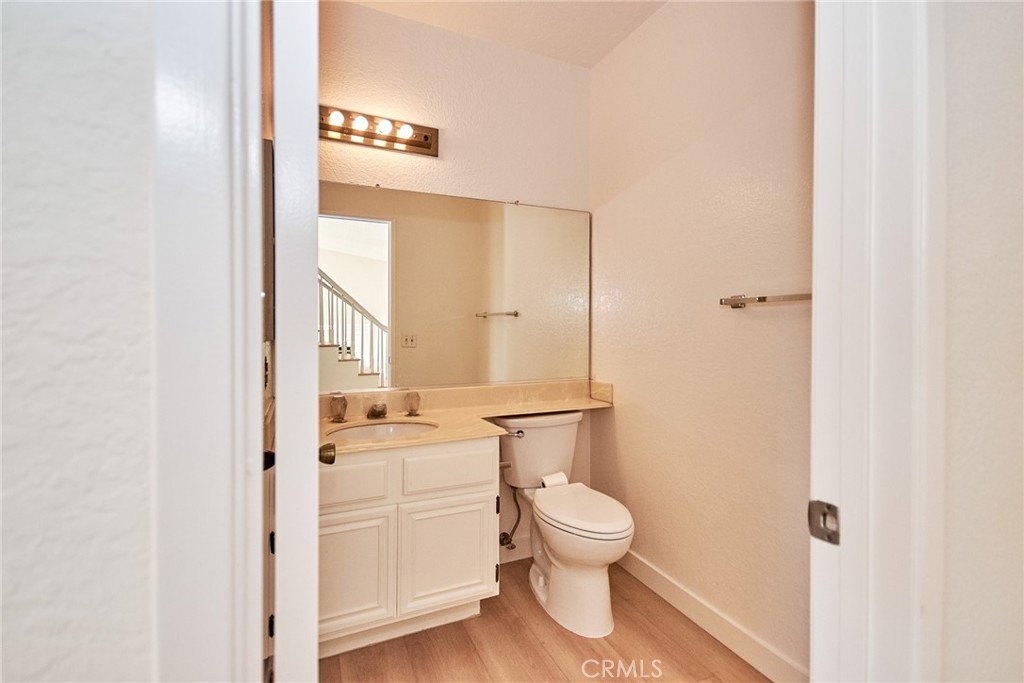 24352 East Rimford Place Diamond Bar, CA 91765 - Photo 8 of 31 a bathroom with a toilet a sink and a mirror