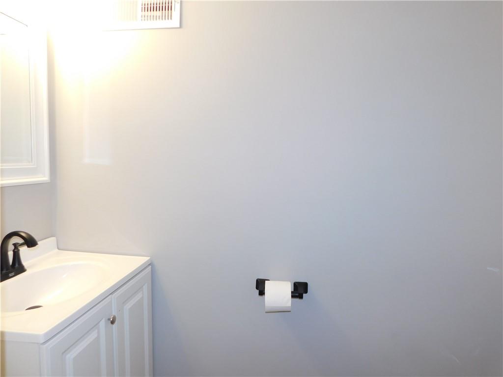 408 3rd Street Allison, PA 15413 - Photo 18 of 40 a bathroom with a sink and mirror