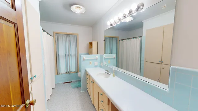 a bathroom with a double vanity sink and mirror