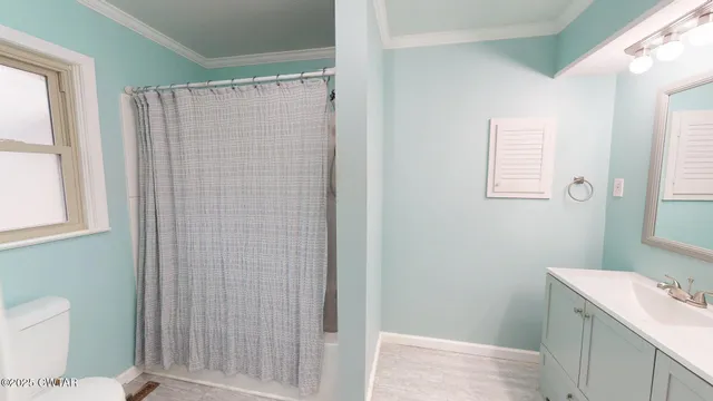 a bathroom with a shower and a toilet