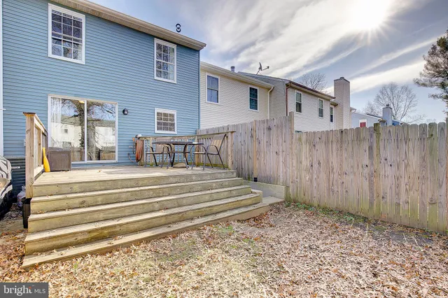 a spacious bathroom with a sink and a mirror