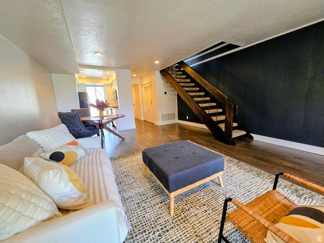 5265 South Rome Beauty Park Murray, UT 84123 - Photo 17 of 35 Living room featuring a textured ceiling and wood finished floors