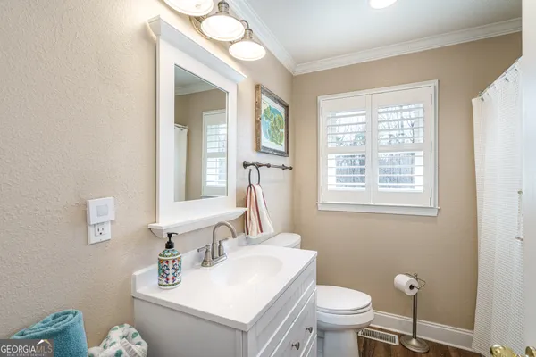 a bathroom with a tub and shower