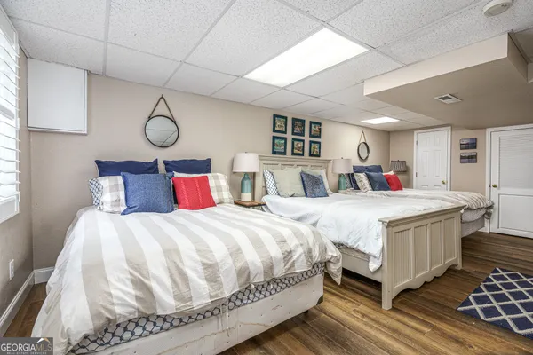 a bedroom with a large bed and a window