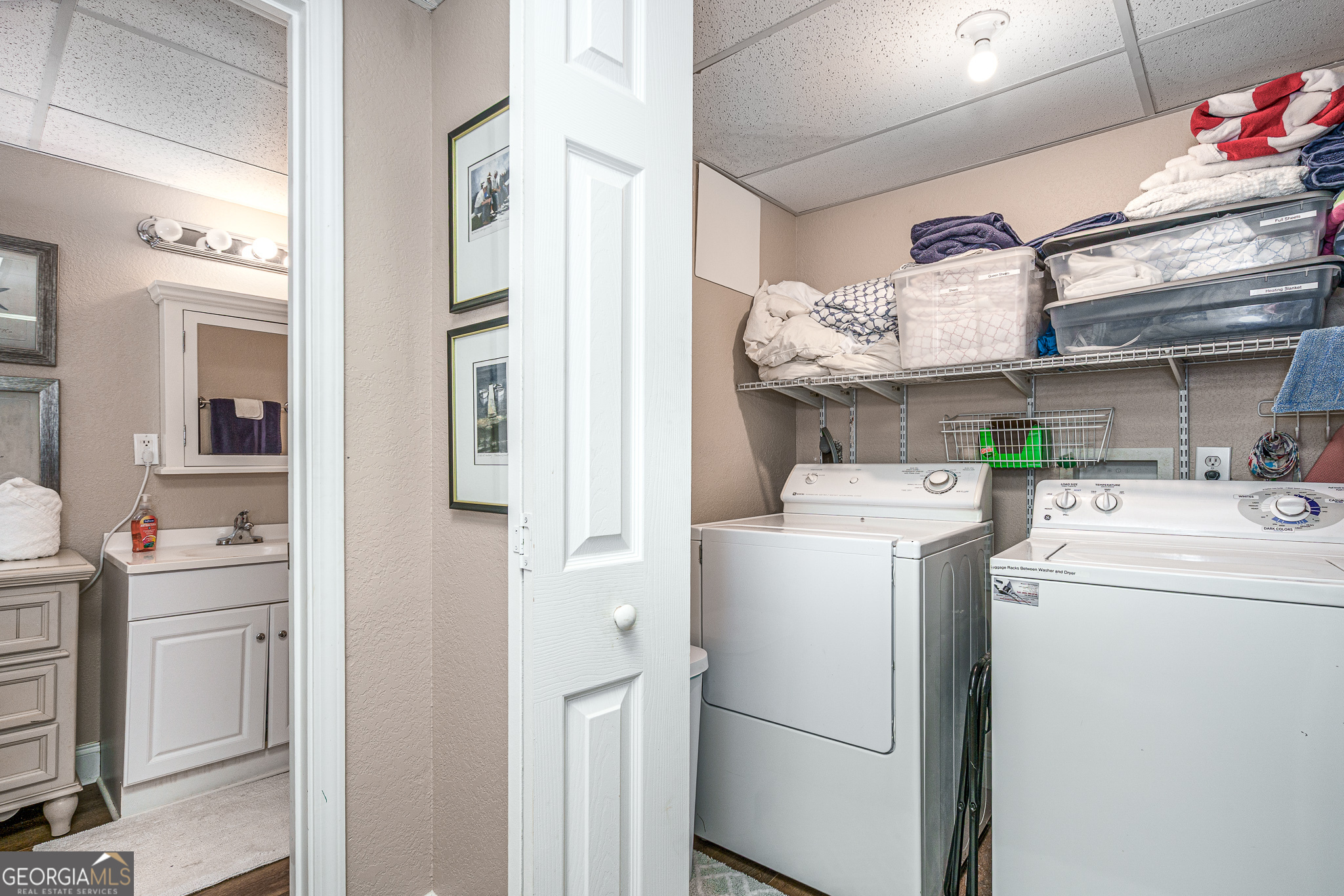 15 Lonesome Pine Road Murphy, NC 28906 - Photo 22 of 61 a view of washer and dryer with kitchen in the background