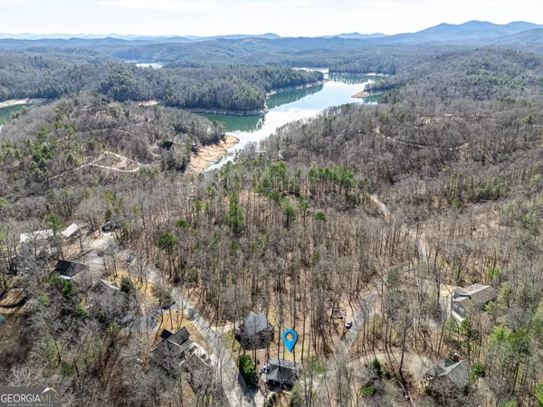 a view of a lake with a house in the background