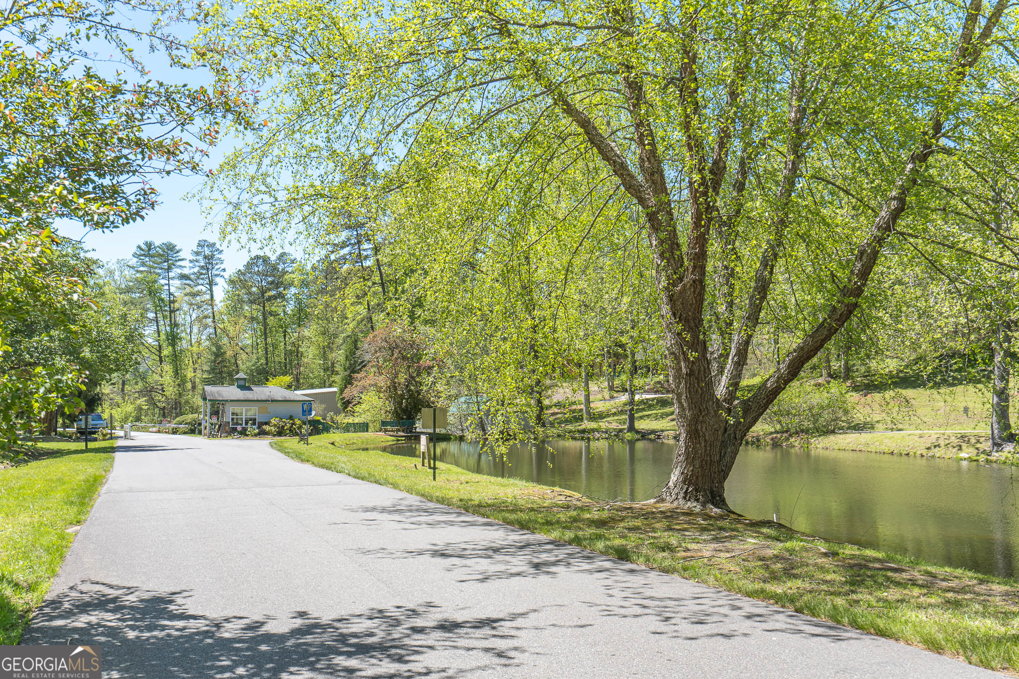 15 Lonesome Pine Road Murphy, NC 28906 - Photo 50 of 61 a wooden bench sitting next to a lake