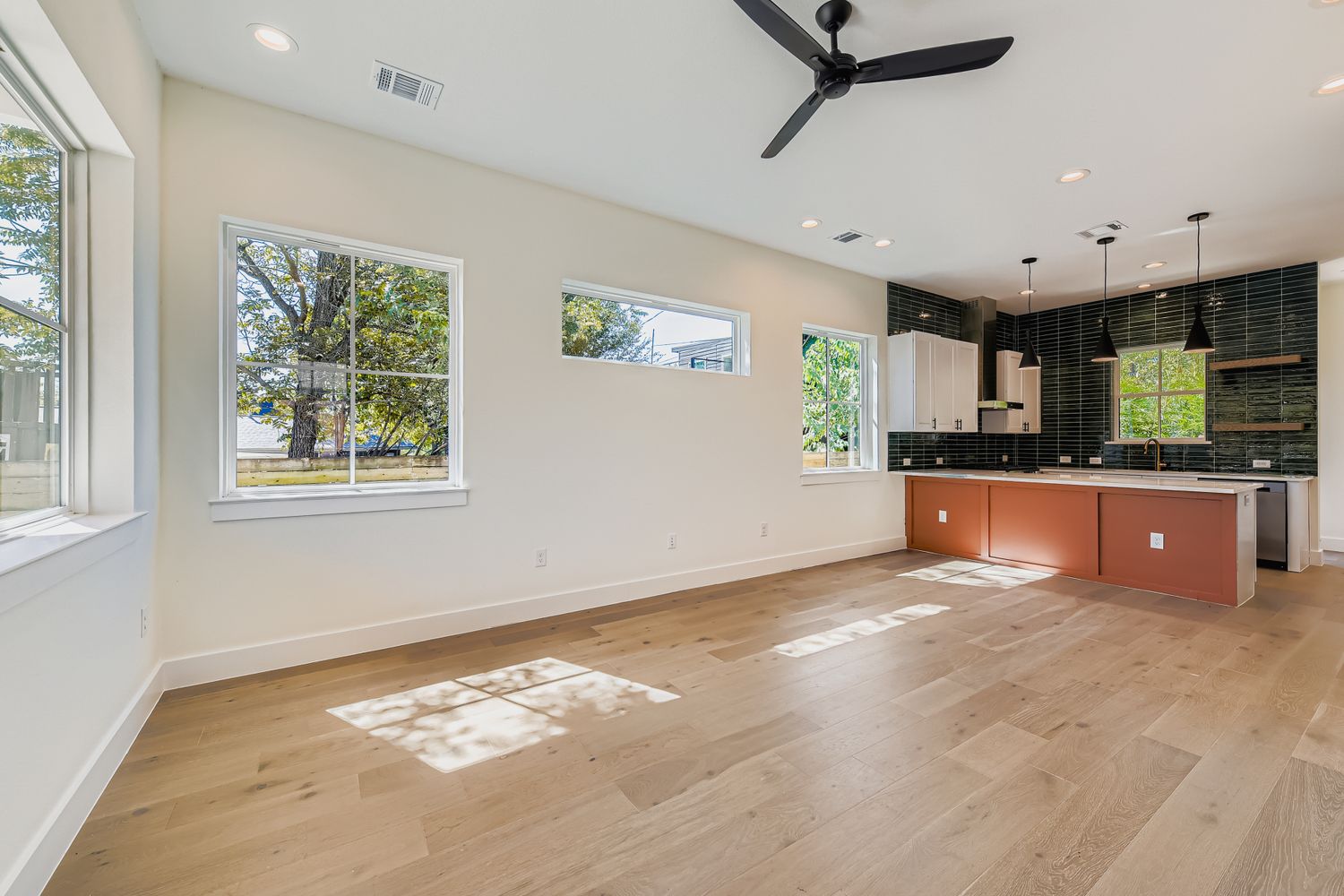 4712 South Forest Drive Austin, TX 78745 - Photo 10 of 27 a view of a kitchen with a sink hardwood floor and a window