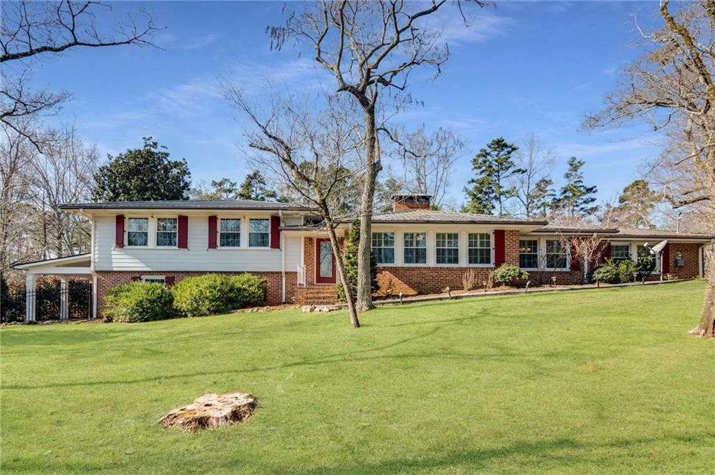 7770 Chestnut Hill Road Cumming, GA 30041 - Photo 1 of 1 Welcome Home to this beautiful 1960's tri-level ranch home on TRIPLE LOTS!
