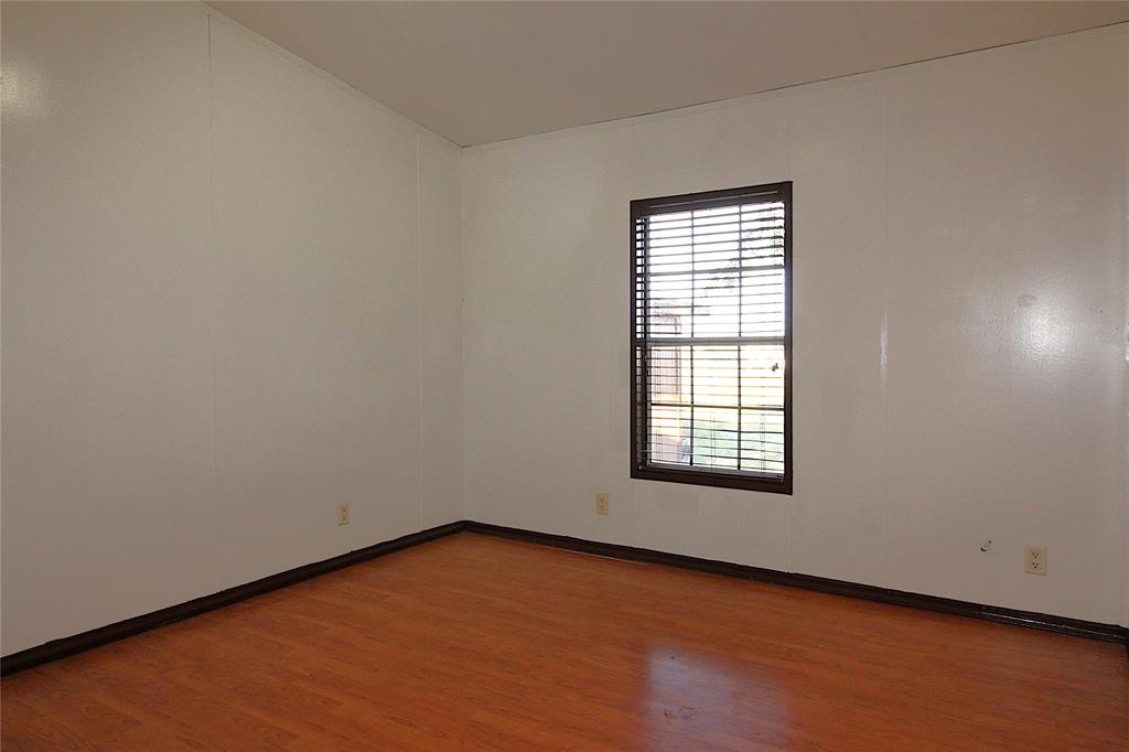 5199 Timarron Drive Scurry, TX 75158 - Photo 20 of 29 an empty room with a window