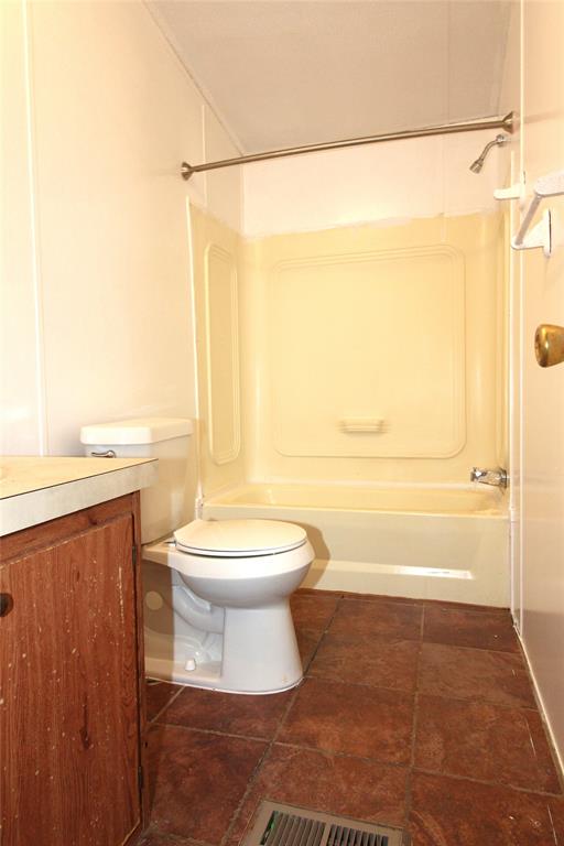 5199 Timarron Drive Scurry, TX 75158 - Photo 22 of 29 a bathroom with a toilet and a shower
