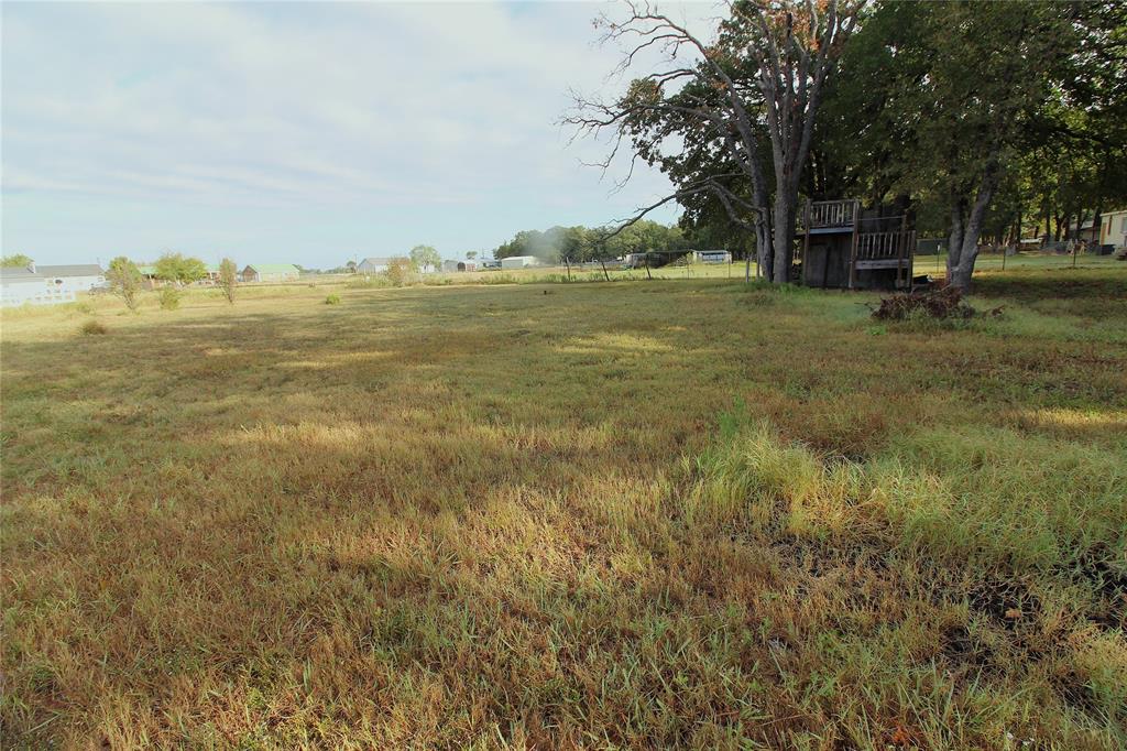 5199 Timarron Drive Scurry, TX 75158 - Photo 4 of 29 a view of a field with an trees
