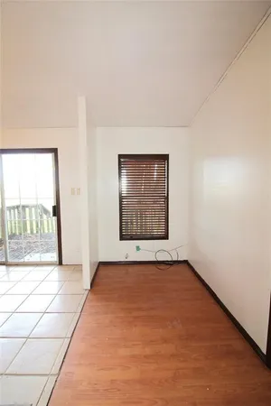 a view of an empty room and window